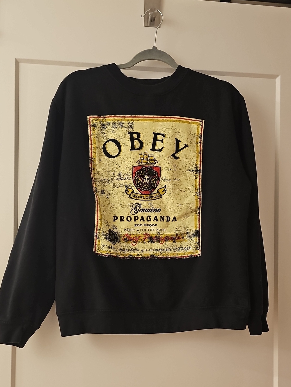 Obey Black Crewneck with Distressed Yellow Graphic Crest
